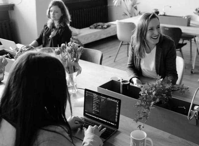 Three women working in an office